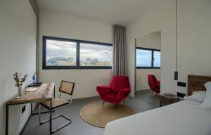 A bed or beds in a room at AFTER Hotel