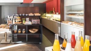 a bakery with a lot of different types of pastries at Crowne Plaza Hotel Brugge, an IHG Hotel in Bruges