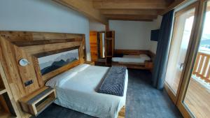 Postel nebo postele na pokoji v ubytování Albergo Alpino