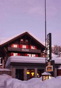 
a large building with a ski lift on top of it at Hotel Bergidyll in Andermatt
