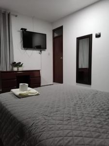 Postel nebo postele na pokoji v ubytování Suite Trujillo