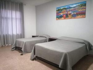 Postel nebo postele na pokoji v ubytování Suite Trujillo