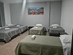 Postel nebo postele na pokoji v ubytování Suite Trujillo