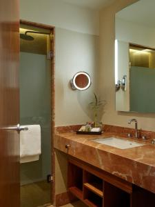 a bathroom with a sink and a mirror at Grand Fiesta Americana Chapultepec in Mexico City
