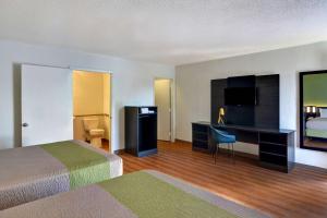A television and/or entertainment centre at Motel 6-Cocoa Beach, FL