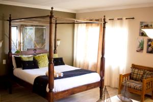 Giường trong phòng chung tại Villa Mexicana Guesthouse