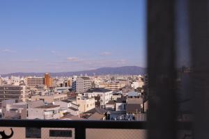 a view of a city from a window at 谷町君 星ホテル 新深江59 in Osaka