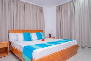 Postel nebo postele na pokoji v ubytování Kolibri Holiday Apartments