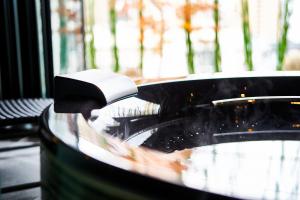a close up of a bathtub with a faucet at gallery hotel KAGUYA in Kyoto +47 photos