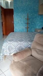 Ein Bett oder Betten in einem Zimmer der Unterkunft Apartamento praia Grande