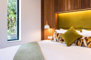 Letto o letti in una camera di Rainforest Deluxe