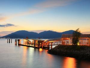 a bridge over a body of water at sunset at WORLD KIDS FANTASY in Lumut +14 photos
