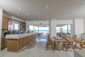 a restaurant with a view of the ocean at Marilyn Apartments in Rethymno Town