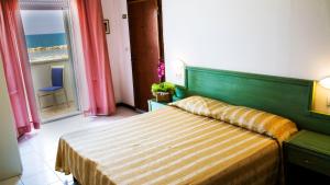 Postel nebo postele na pokoji v ubytování Hotel Villa Sole Resort