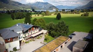 an aerial view of a hotel with mountains in the background at Gasthof Wiesenhof in Strobl