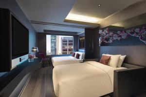 Ліжко або ліжка в номері Hotel Pravo Hong Kong