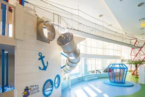 a rocket in a room with a wall at Lotte Resort Sokcho in Sokcho