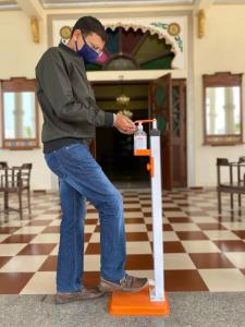a man wearing a mask standing on an orange object at Dowlat Villas Palace-The Heritage in Himatnagar