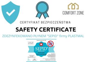 a label for a safety certificate with a blue ribbon at Comfort Zone Ostróda Ruś Mała in Ostróda