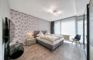 Katil atau katil-katil dalam bilik di Apartment Haus Tiefenbach +21 gambar