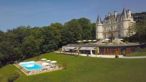 an aerial view of a castle with a swimming pool at Domaine de la Tortinière in Montbazon