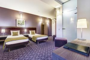Postel nebo postele na pokoji v ubytování Hotel Metropol + 36 fotografií