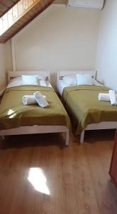 Postel nebo postele na pokoji v ubytování Retro Panzió