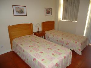 Ліжко або ліжка в номері Apartamentos Varandas da Rocha