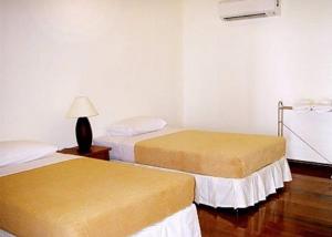 Ein Bett oder Betten in einem Zimmer der Unterkunft Baan Klang Aow Beach Resort