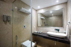 Vannituba majutusasutuses Hotel Aadithya