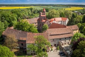 an aerial view of an old building with a tower at Schloß Altenhausen in Altenhausen