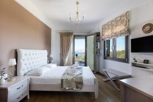 Posteľ alebo postele v izbe v ubytovaní Villa Chryssi
