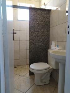 Et badeværelse på Flats Aconchego com Ar condicionado