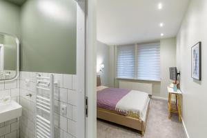 Postel nebo postele na pokoji v ubytování Art & Comfort Rooms