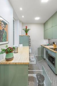 Kuchyň nebo kuchyňský kout v ubytování Art & Comfort Rooms