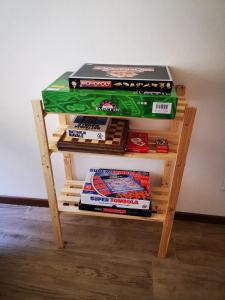 a table with a stack of boxes on top of it at B & B La Mela in Darfo