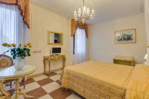 Postel nebo postele na pokoji v ubytování Hotel Bernardi Semenzato
