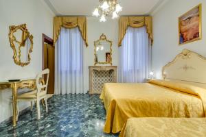 Postel nebo postele na pokoji v ubytování Hotel Bernardi Semenzato