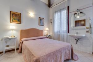 Postel nebo postele na pokoji v ubytování Hotel Bernardi Semenzato