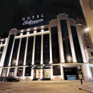 a hotel building with a sign on it at night at Silken Coliseum in Santander