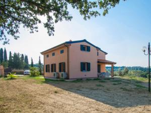 a small house in the middle of a field at Holiday Home La Rocchetta by Interhome in Montescudaio