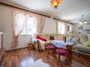 a living room with a couch and a table at Holiday Home Saulja by Interhome in Sveti Juraj