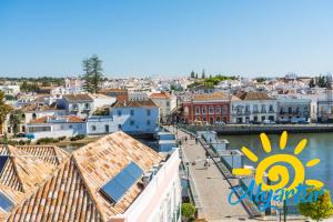 a view of a city with a river and buildings at Casa Florinda in Tavira