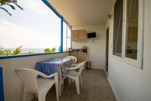 TV a/nebo společenská místnost v ubytování Ваканционни къщи'На брега' Holiday houses ON THE COAST