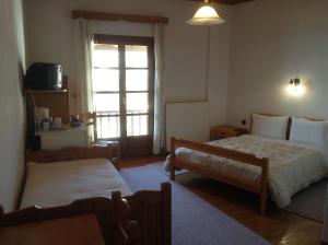 Voodi või voodid majutusasutuse Guesthouse Kontorizos toas