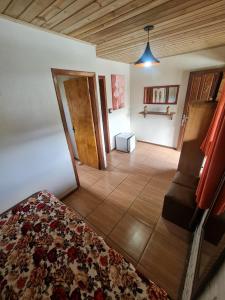 A bed or beds in a room at Hotel Praia Do Rosa