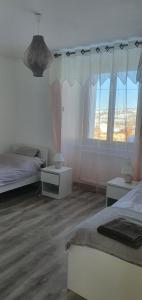 Ένα ή περισσότερα κρεβάτια σε δωμάτιο στο Lamour