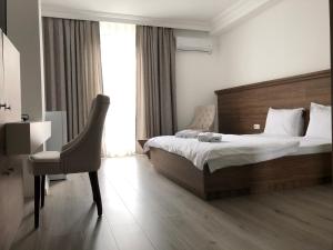 Postel nebo postele na pokoji v ubytování Hotel Dardani