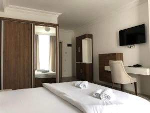 Postel nebo postele na pokoji v ubytování Hotel Dardani
