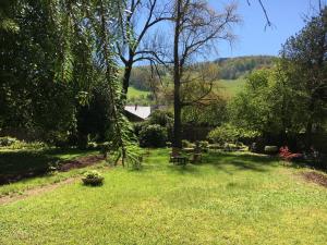 a park with a picnic table and benches in the grass at La Clé d'Alsace in Sainte-Marie-aux-Mines +6 photos